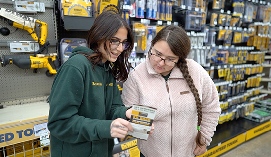 employee assisting a customer with the FFH Credit Card